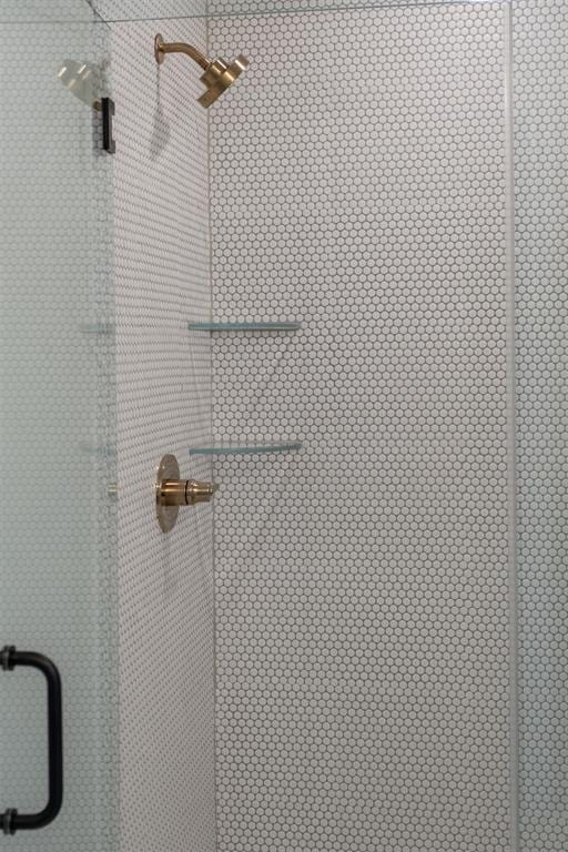 room details with an enclosed shower