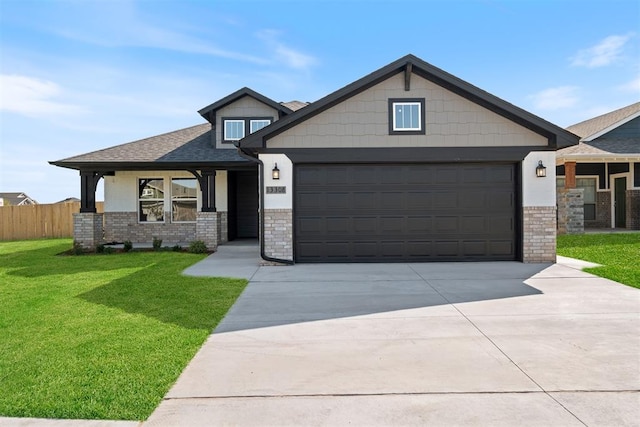 craftsman-style home featuring a garage and a front yard