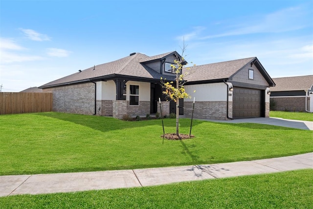 view of front of house with a garage and a front yard