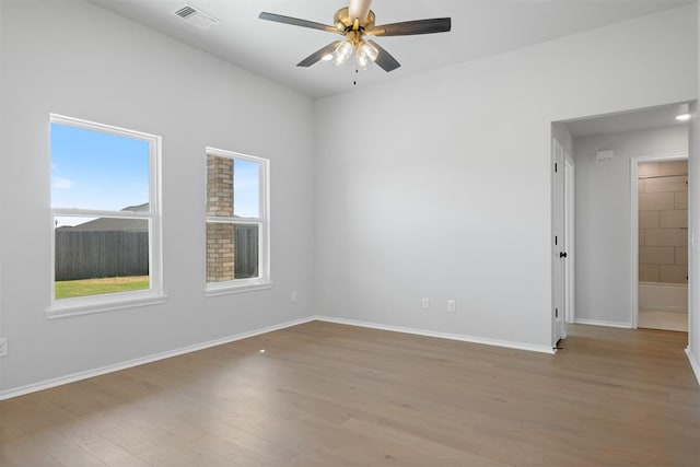 unfurnished room featuring ceiling fan and light hardwood / wood-style flooring