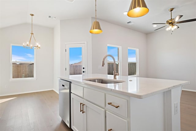 kitchen with dishwasher, white cabinets, sink, an island with sink, and dark hardwood / wood-style flooring