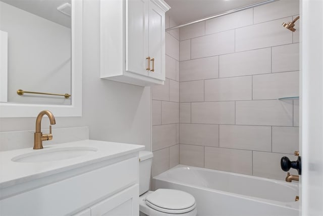 full bathroom with vanity, toilet, and tiled shower / bath