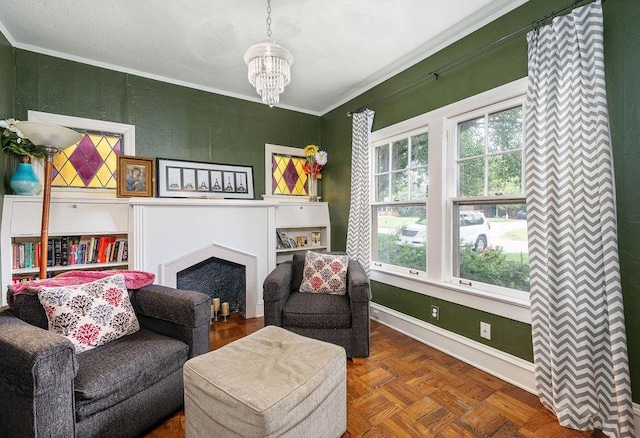 living area with a chandelier, dark parquet flooring, and ornamental molding