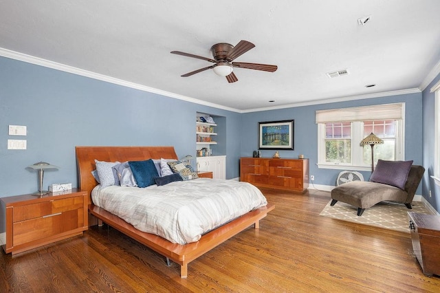 bedroom featuring hardwood / wood-style flooring, ceiling fan, and ornamental molding