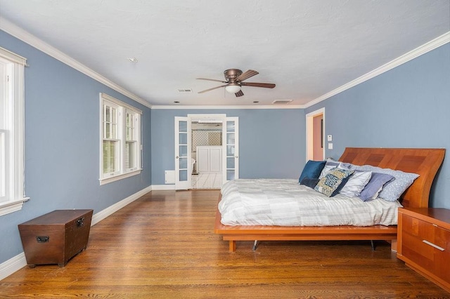 bedroom featuring hardwood / wood-style floors, ceiling fan, and crown molding