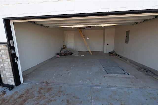 garage featuring a garage door opener and electric panel