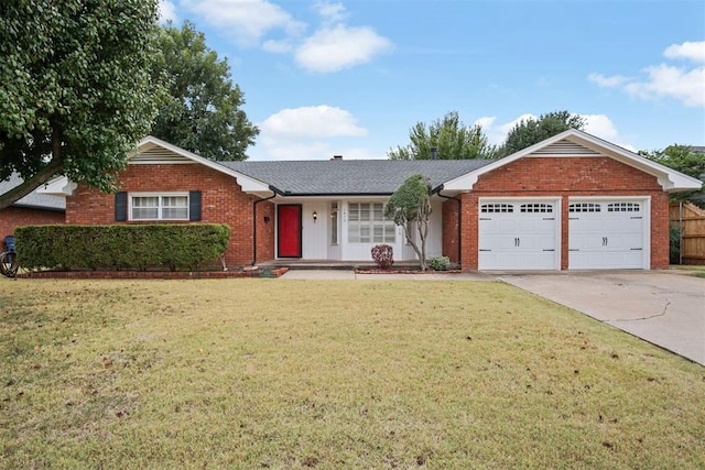 ranch-style house featuring a garage and a front lawn