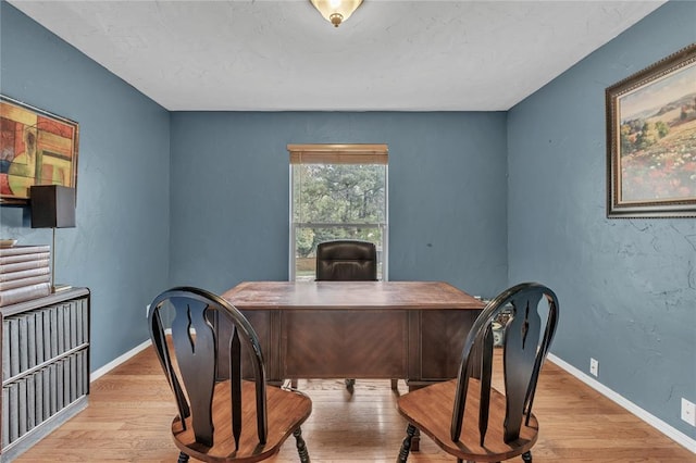 home office with light wood-type flooring