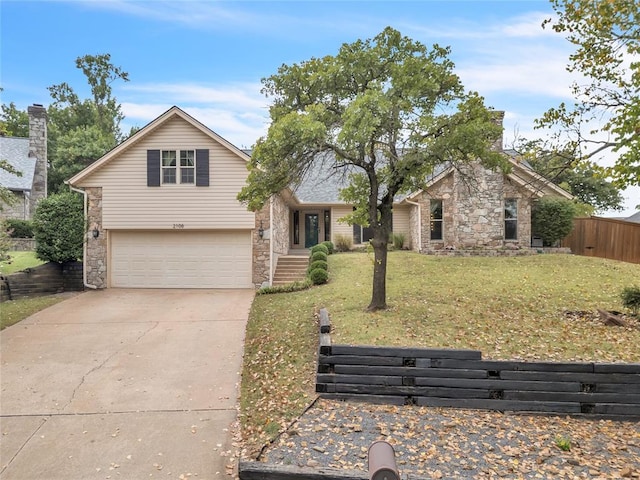 view of front of house with a garage and a front yard