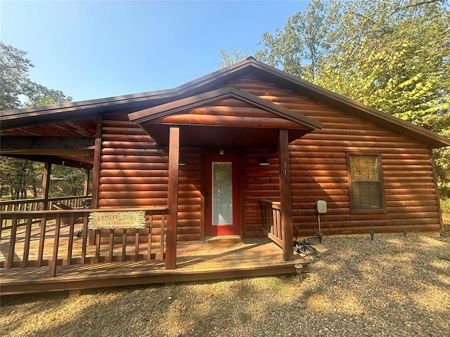 log cabin with a deck