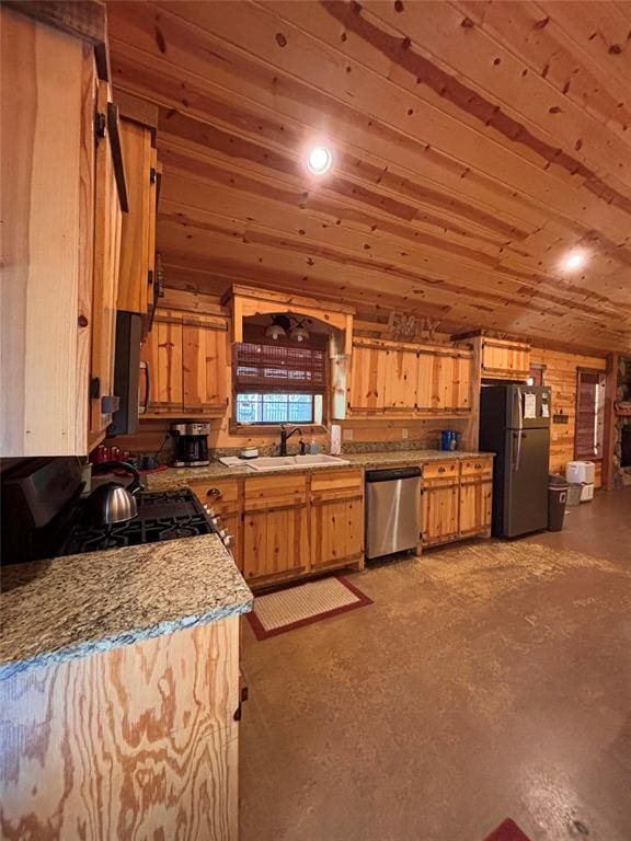 kitchen with sink, wooden walls, light stone countertops, wood ceiling, and stainless steel appliances