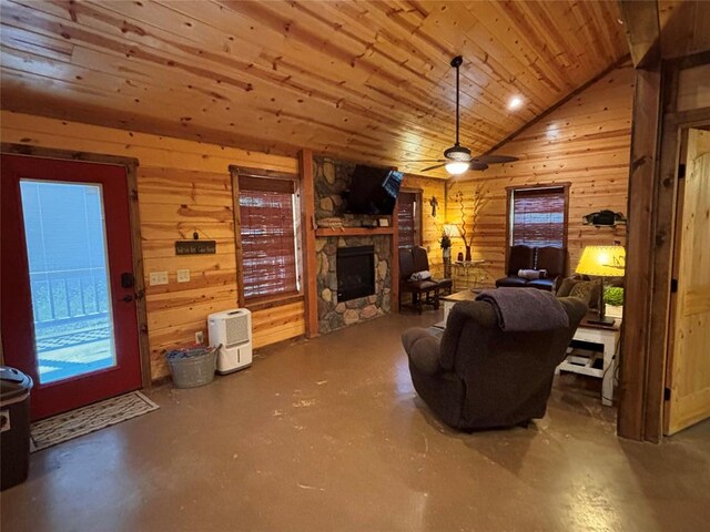 living room featuring concrete floors, vaulted ceiling, wooden walls, and wood ceiling