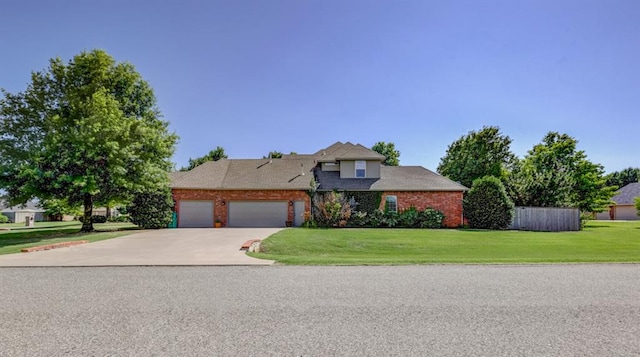 view of front facade featuring a front yard and a garage