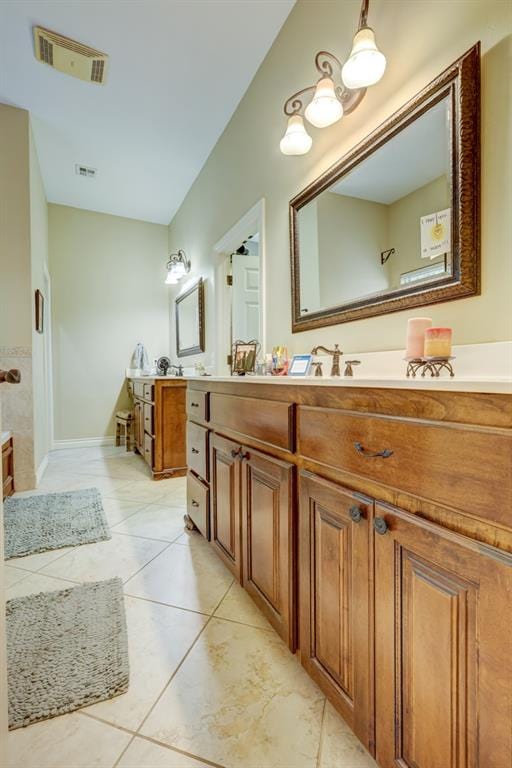 bathroom featuring tile patterned flooring and vanity