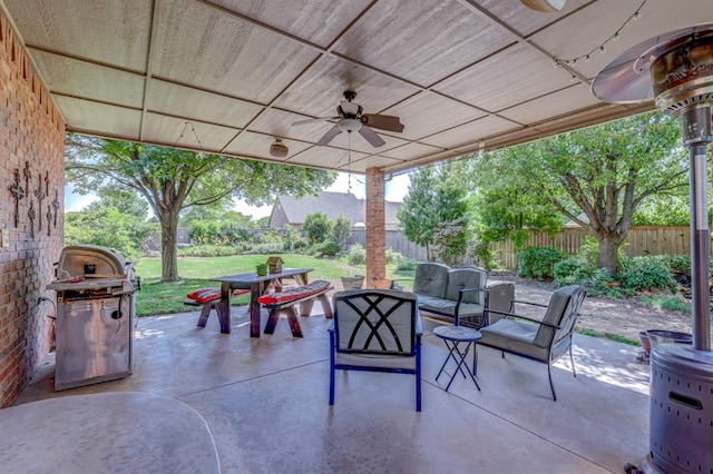 view of patio / terrace featuring outdoor lounge area, ceiling fan, and grilling area