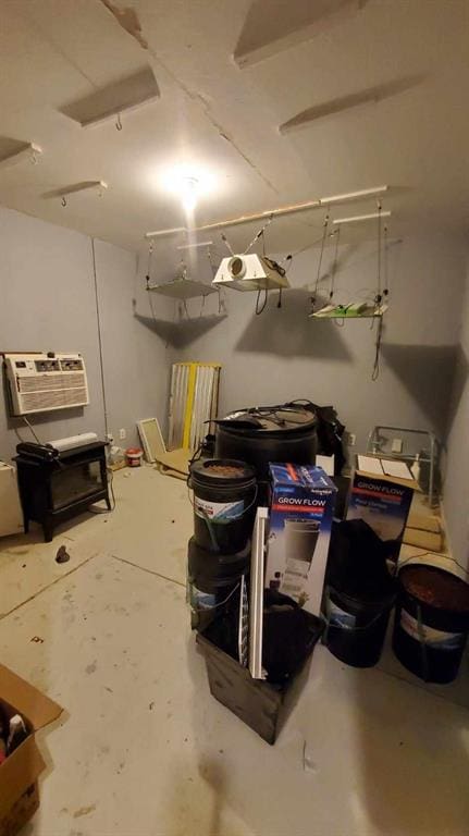 basement with a wall mounted air conditioner