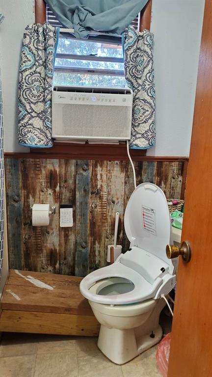 bathroom with tile patterned flooring and toilet