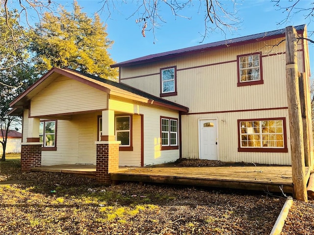 back of house featuring covered porch