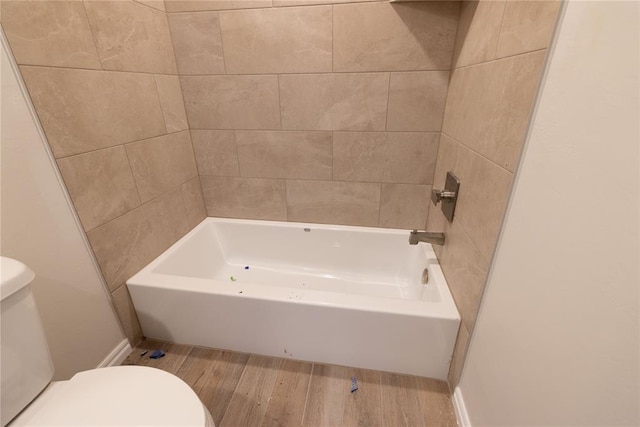 bathroom featuring wood-type flooring and toilet