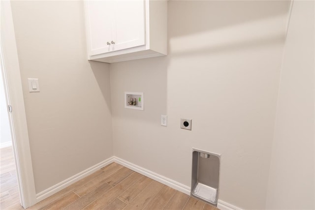 laundry area with cabinets, hookup for an electric dryer, washer hookup, and light hardwood / wood-style flooring