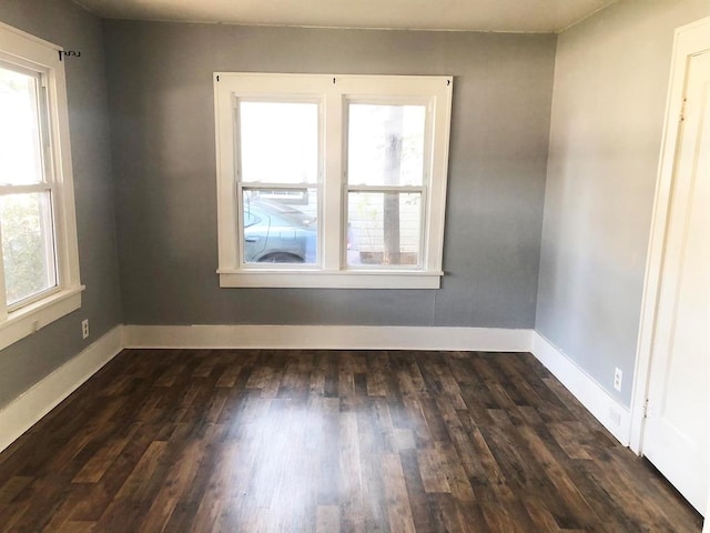 empty room featuring dark hardwood / wood-style floors