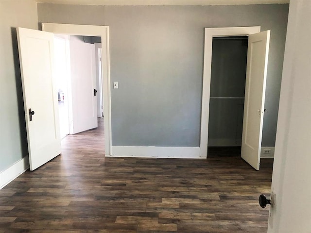 spare room featuring dark hardwood / wood-style floors