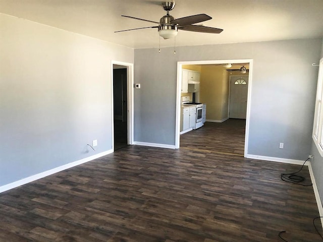 spare room featuring dark wood-type flooring