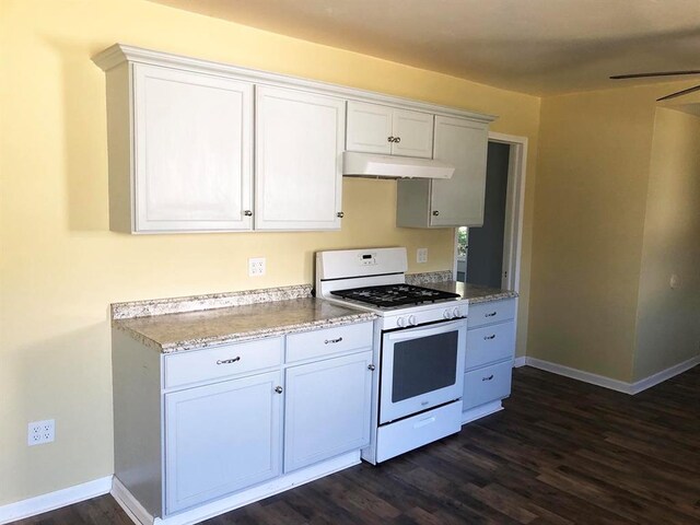 kitchen featuring white cabinetry, dark hardwood / wood-style flooring, ceiling fan, and white gas range oven