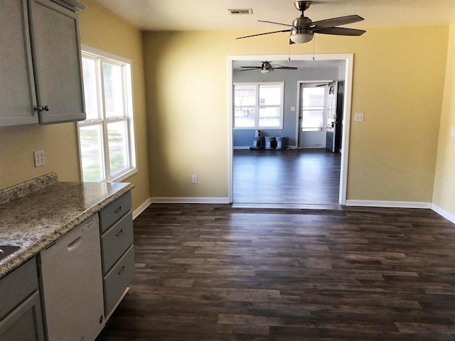 kitchen with dark hardwood / wood-style floors, a healthy amount of sunlight, and gray cabinetry