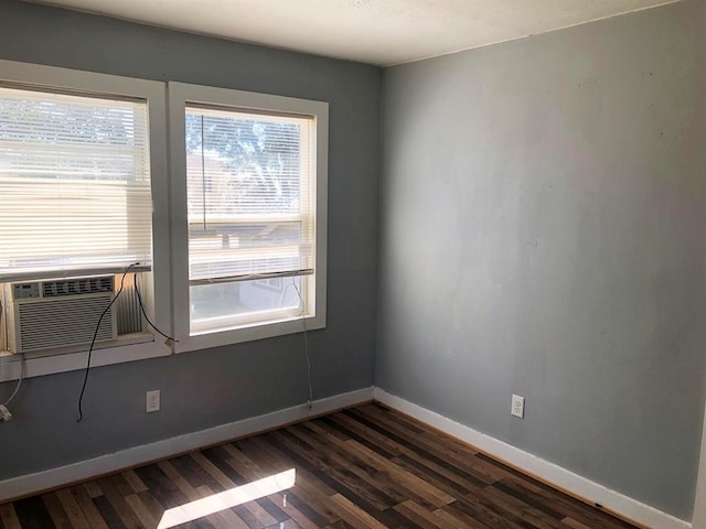 spare room featuring dark hardwood / wood-style floors