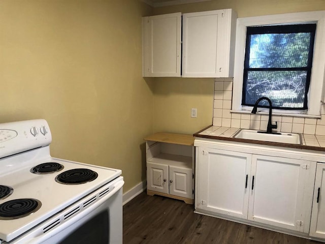 kitchen with dark wood-type flooring, sink, tasteful backsplash, white electric range oven, and white cabinetry