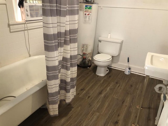 full bathroom featuring sink, gas water heater, cooling unit, toilet, and hardwood / wood-style flooring