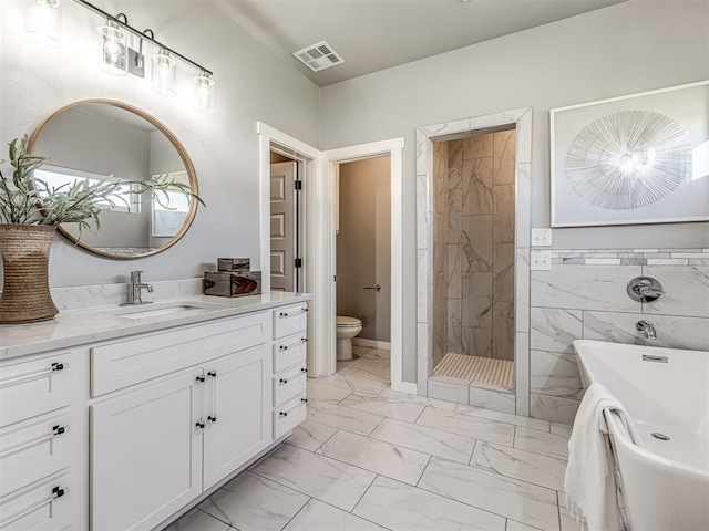 full bathroom with vanity, separate shower and tub, toilet, and tile walls