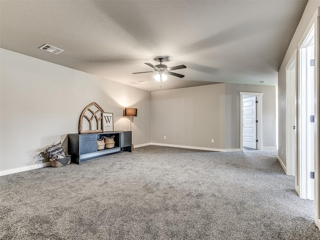 unfurnished living room featuring carpet flooring and ceiling fan