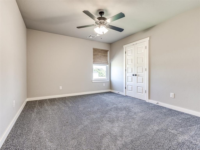 unfurnished room with carpet floors and ceiling fan