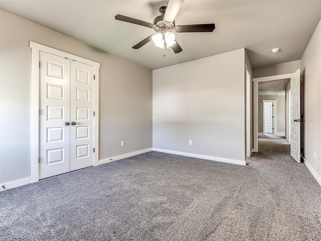 unfurnished bedroom featuring ceiling fan, a closet, and carpet