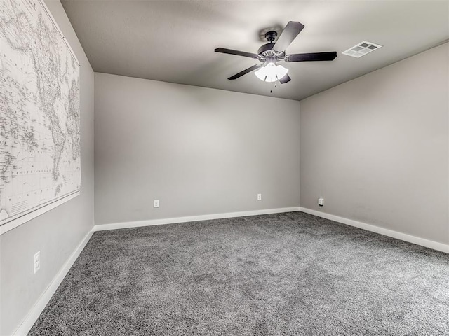 spare room with ceiling fan and carpet floors