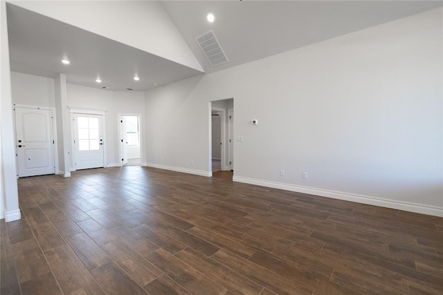 unfurnished room featuring high vaulted ceiling, recessed lighting, dark wood-style flooring, visible vents, and baseboards