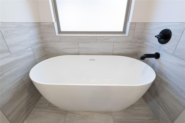 full bath featuring a soaking tub