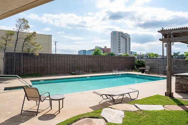 view of swimming pool with a pergola and a patio