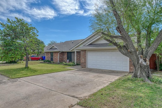 single story home with a garage and a front lawn