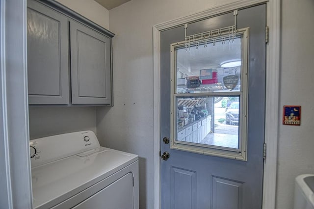 laundry area featuring cabinet space and washer / clothes dryer