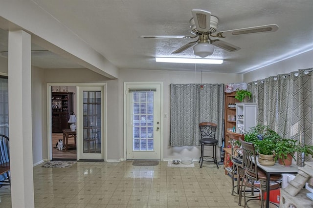 interior space featuring a ceiling fan