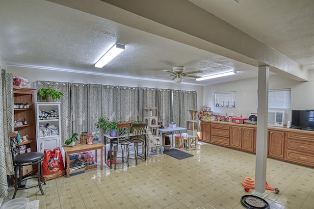 interior space with ceiling fan