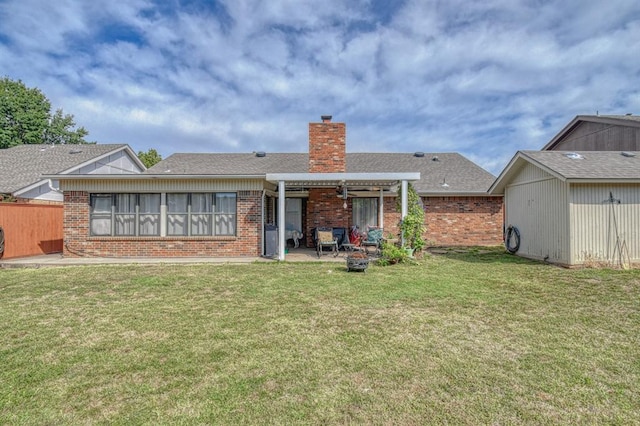 rear view of house featuring a patio area, brick siding, a chimney, and a pergola