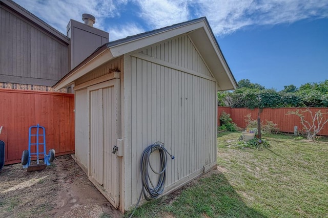 view of shed featuring a fenced backyard