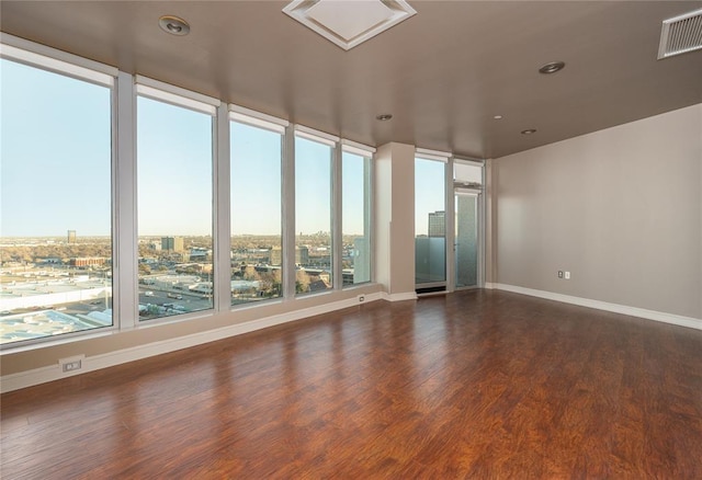 unfurnished room featuring dark hardwood / wood-style floors