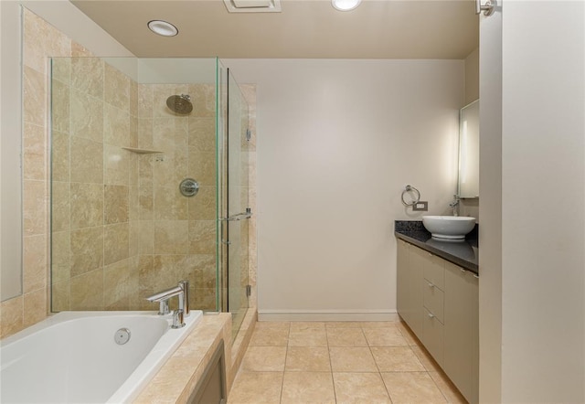 bathroom featuring vanity, separate shower and tub, and tile patterned floors