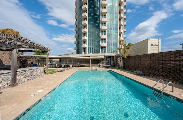 view of pool featuring a patio and a pergola