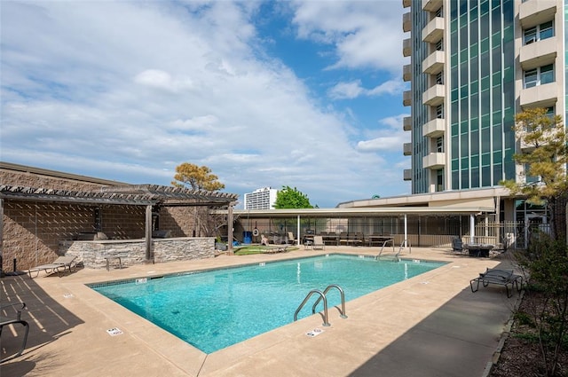 view of pool with a pergola and a patio